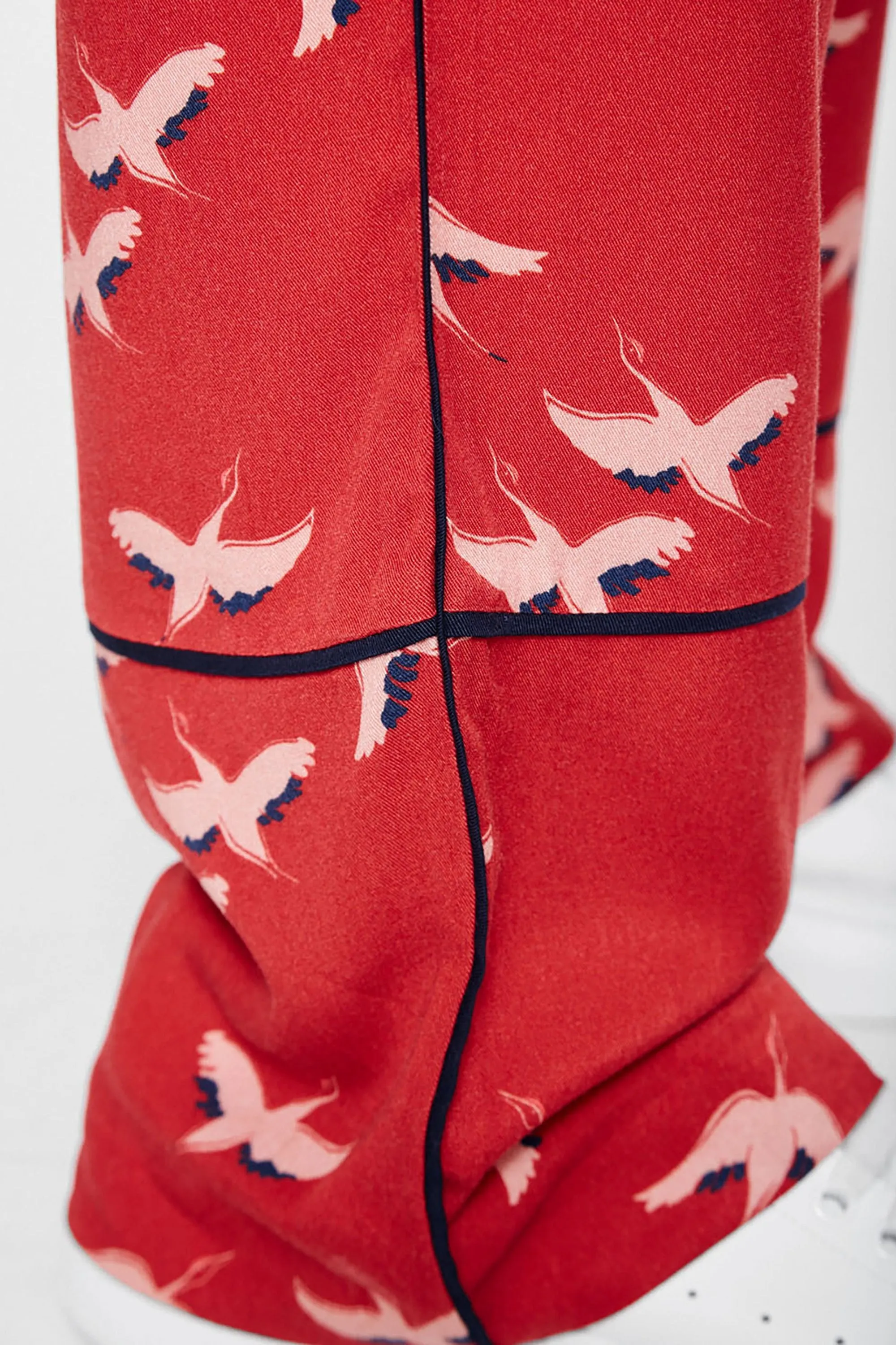 bendi pants <br> red & cranes in the sky <br> by ARMEDANGELS